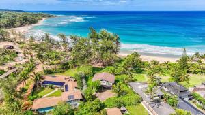 an aerial view of a house and the beach at Anahola Beach House 6br in Anahola