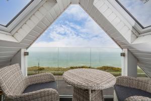 a view of the ocean from the balcony of a house at Seaview apartment in Southbourne