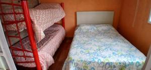 a small room with a bunk bed and a bunk bedsheet at Casa Quinta Nuevo Torino -15 min de Rafaela in Nuevo Torino +13 photos