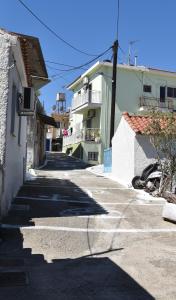 a group of buildings in a street with at Maritsa's Cozy Apartment in Mytilinioí