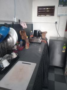 a kitchen counter with a counter top with a counter top at coco weli in Weligama