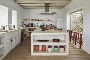 a kitchen with a counter with colorful shoes on it at The Margi Villa Mykonos in Agios Sostis Mykonos