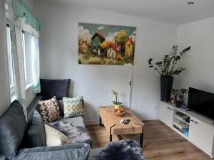 a living room with a couch and a table at U Přejezdu in Česká Lípa