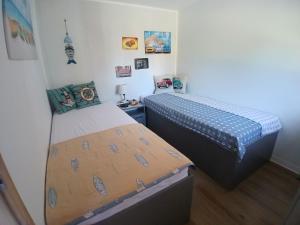 a bedroom with two twin beds in a room at U Přejezdu in Česká Lípa