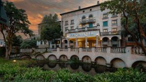 a building with a river in front of it at Piazza Hotel Montecasino in Johannesburg