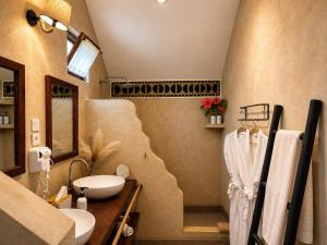 a bathroom with a sink and a toilet in it at Juana Ocean Villas in Makunduchi