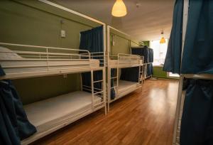 a group of bunk beds in a room at Urban Garden Hostel in Lisbon +59 photos
