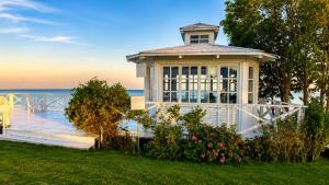 a house on the beach with the ocean in the background at Guest House Forest 20 in Balchik