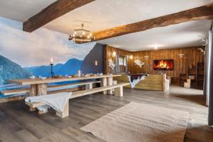 a living room with a table and a fireplace at Iaks keramik in Saumont-la-Poterie