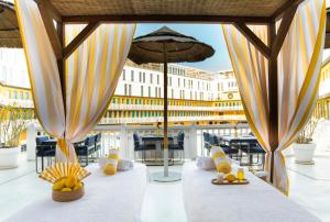 a group of stuffed animals sitting on a table on a patio at Molitor Hotel & Spa Paris - MGallery Collection in Paris