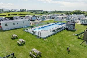 an aerial view of a house with a swimming pool at Polls Place in Caernarfon