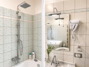 a bathroom with a shower and a bath tub at Bellavista B&B in Roccavivara +52 photos