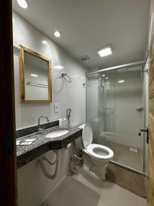 a bathroom with a toilet and a shower and a sink at Danny's Hotel in Tailandia +30 photos