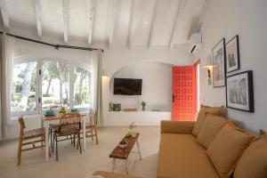a living room with a couch and a table at Quinta la Sal by SingularStays in Jávea