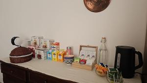 a counter top with snacks and a bottle on it at B&B Le Fontane in Bono