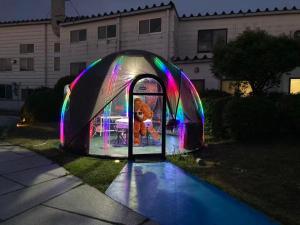 a teddy bear in a tent in a yard at 結良house in Yura