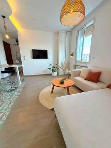 a living room with a couch and a table at Emeraude in Tunis