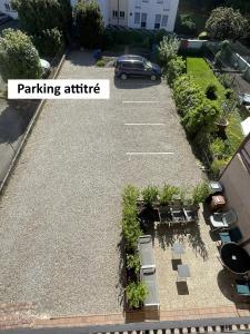 an aerial view of a parking lot with a car parked at Appartements centre ville Colmar 4 familles in Colmar