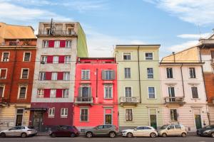 a group of buildings with cars parked in front of them at Lulli mansarda- 7Sundays in Milan