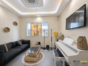 a living room with a couch and a table at Chic apart with a view in Yaoundé