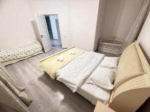 a small bedroom with a bed and a mirror at Dilisharm in Dilijan