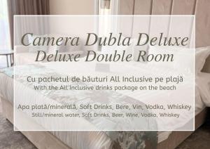 a sign that reads cancerdbudida deluxe deluxe double room at Panoramic Mamaia Hotel in Mamaia