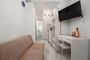 a small living room with a couch and a table at Casa Tradizionale in Rhodes Town