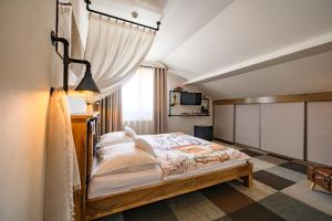 a bedroom with a bed in a room at Maravar - Beer Spa - Adults Only in Liptovský Trnovec