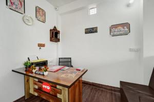 an office with a desk with akeep sign on it at Hotel O Radha Krishna Family Hotel in Naubatpur