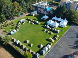 an aerial view of a group of tents on a lawn at Peaks Hotel Nanyuki in Nanyuki