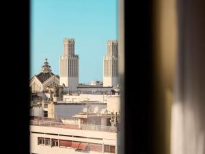 a view of a city from a window at Le Diwan Hotel Rabat - MGallery Collection in Rabat