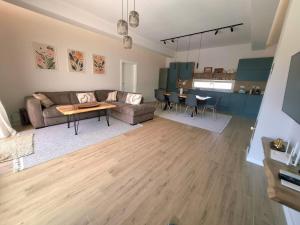 a living room with a couch and a table at Villa Velaris Mostar in Mostar