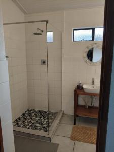 a bathroom with a shower and a sink at The Museum in Sabie +39 photos
