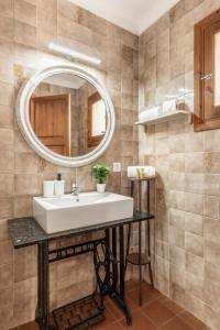 a bathroom with a sink and a mirror at Malpas in Cielo de Bonaire  +24 photos