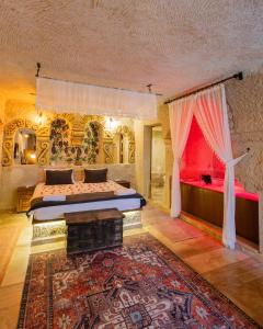 a large bedroom with two beds and a rug at Bayar Cave Suites Special Class in Ürgüp
