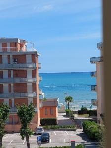 a view of the ocean from a building at Monolocale 100metri dal mare in Fano