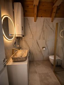 a bathroom with a sink and a toilet at Stress Away in Zlatibor +40 photos