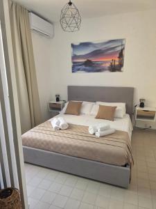a bedroom with a bed with towels on it at Monolocale 100metri dal mare in Fano
