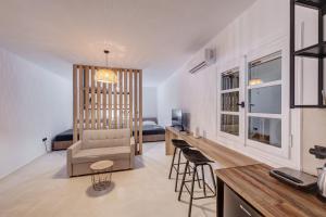a living room with a couch and a table at Βlue Lagoon G6 in Galissas