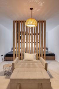 a room with a large bed and a large table at Βlue Lagoon G6 in Galissas