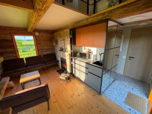 an overhead view of a kitchen and a living room at Sunset sauna Bauska in Jumprava +49 photos