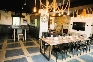 a large dining room with a long table and chairs at Durbuy House in Durbuy