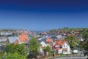 a view of a town with houses and trees at Spinnaker, Whitehall in Ardeonaig