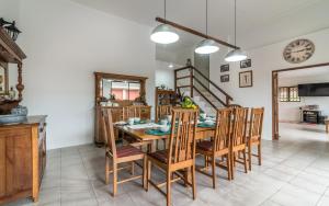 a dining room with a wooden table and chairs at The 3rd Leg Bed and Breakfast in Pennington