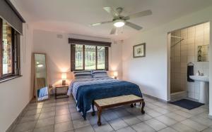a bedroom with a bed and a ceiling fan at The 3rd Leg Bed and Breakfast in Pennington
