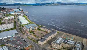 an aerial view of a city and the water at Ocean Quay in Greenock