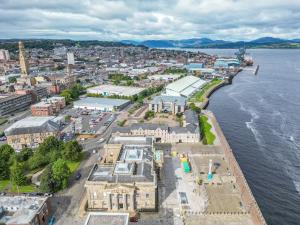 an aerial view of a city next to the water at Ocean Quay in Greenock