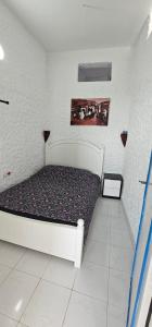 a small bedroom with a bed in a room at Rychance Playa Blanca Tanger in Tangier +18 photos