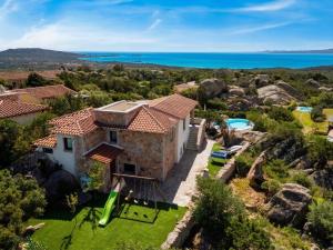 an image of a villa with a view of the ocean at villa Le farfalle in San Teodoro