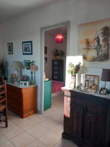 a living room with a counter and a room with a table at Villa Cardicciosa in Ghisonaccia